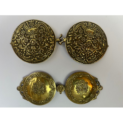 47 - A PAIR OF GILT BELT BUCKLES
Of rounded
 form, each with floral and foliate embossed decoration78 gr,... 