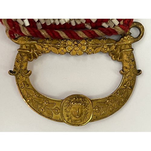 50 - A CRAFTMANSHIP BEADWORK BELT WITH BUCKLE

Mounted on a cream textile, adorned with successive eight ... 