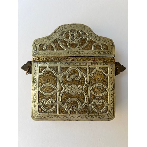 52 - A METAL 
AND BRASS NOMAD QUR’AN BOX OR CASE, MOROCCO, 20TH CENTURY
Of rectangular form with with a h... 