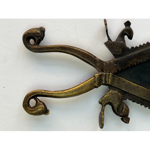 54 - A METAL SUGAR AND BETEL NUT CRACKER
A brass sugar and nut cracker, featuring two scissor-like handle... 