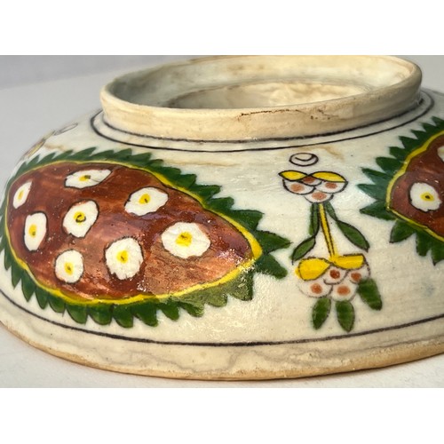 60 - A KUTAHYA POTTERY BOWL
Of circular form, resting on short foot, with raised cavetto decorated with a... 