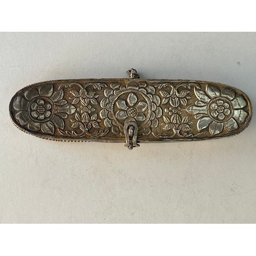 61 - AN ENGRAVED METAL PEN CASE
Of typical form with rounded ends and a lid, decorated with embossed flow... 