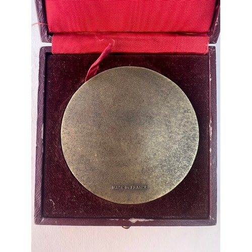 64 - A KA'BA MEDALLION
Of circular form, a metal medallion depicting the Holy Kaaba, presented on a velve... 