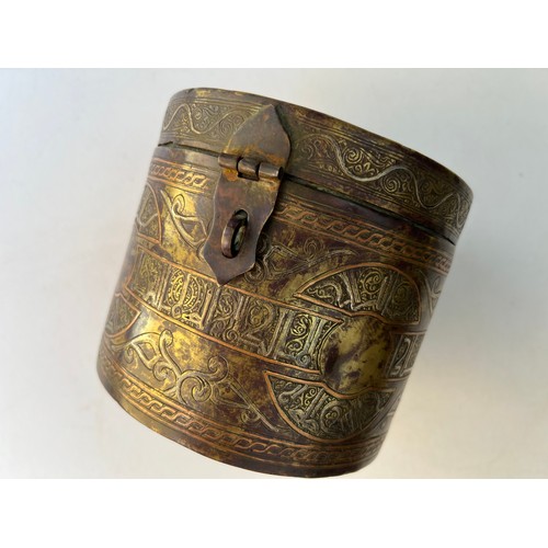 65 - A KHORASSAN STYLE LIDDED BOX

Of circular form, decorated with silver-inlaid Arabic inscriptions wit... 