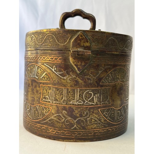 65 - A KHORASSAN STYLE LIDDED BOX

Of circular form, decorated with silver-inlaid Arabic inscriptions wit... 