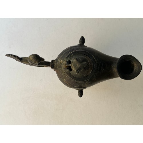 67 - A BRONZE ORNAMENT AS AN INCENCE BURNER OR OIL LAMP
Of rounded form, resting on a splayed circular fo... 