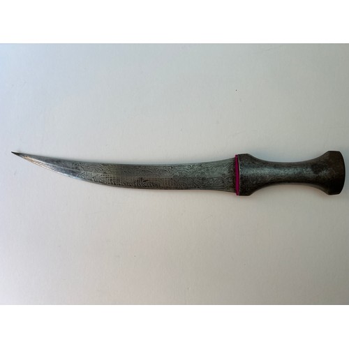 72 - A STEEL BLADE
With a single-edged, slightly curved steel blade decorated with Arabic calligraphy, wi... 