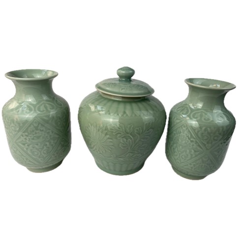 87 - A SET OF CHINESE CELADON PORCELAIN
A pair of Chinese Celadon vases and a jar with lid, bearing four ... 