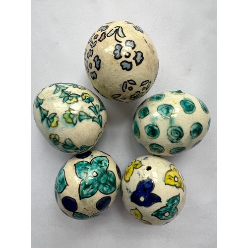 89 - A SET OF FIVE KUTAHYA ORNAMENT EGGS
each Ovoidal form, florish decoration, glazed, with suspension h... 