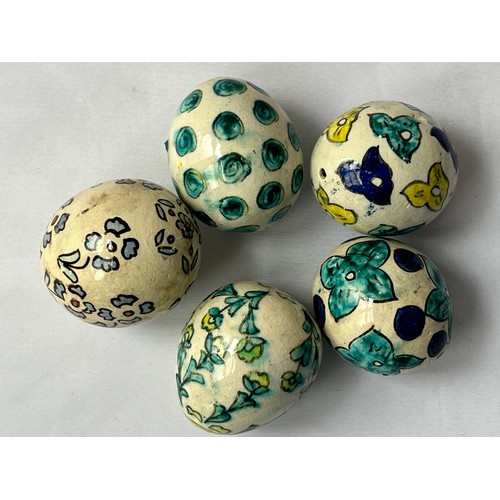 89 - A SET OF FIVE KUTAHYA ORNAMENT EGGS
each Ovoidal form, florish decoration, glazed, with suspension h... 