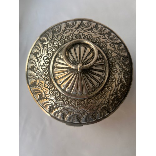 91 - A LARGE SILVER ROUND LIDDED BOX
MIDDLE EAST, OMAN
Of circular form, the hinged lid featuring a centr... 