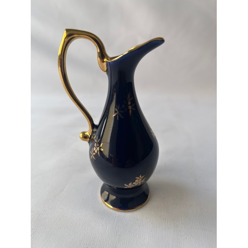 92 - A FINE PORCELAIN TINY EWER, 
LIMOGES, CASTEL
FRANCE
22K gold and cobalt blue ewer, florting couple d... 