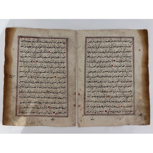 109 - TWO CONSECUTIVE QUR’AN LEAVES, WITH SURA AL-TAWBAH (9:2-23)
Arabic manuscript on paper, 15ll of blac... 