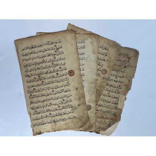 57 - 4 FOLIOS FROM A QURAN, AFRICA, LATE 19TH CENTURY 

Arabic manuscript on paper, 15ll. of black reyhan... 