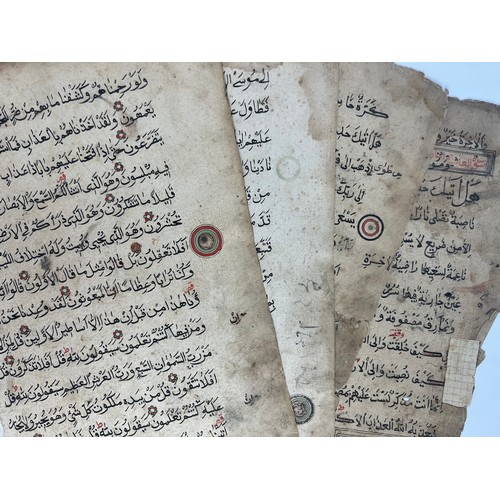 57 - 4 FOLIOS FROM A QURAN, AFRICA, LATE 19TH CENTURY 

Arabic manuscript on paper, 15ll. of black reyhan... 