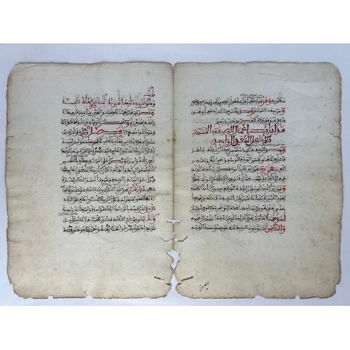 61 - A BIFOLIO FROM A RELIGIOUS BOOK, NORTH AFRICA, 19TH CENTURY 

Arabic manuscript on paper, 14ll. of b... 