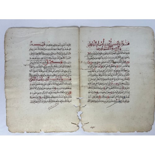 61 - A BIFOLIO FROM A RELIGIOUS BOOK, NORTH AFRICA, 19TH CENTURY 

Arabic manuscript on paper, 14ll. of b... 