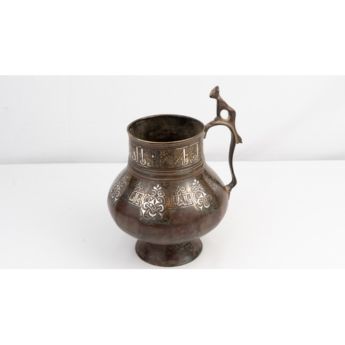 4 - A KHORASSAN SILVER INLAID BRONZE JUG,
NORTH EAST IRAN,
12TH/13TH CENTURY   Benetictory inscription i... 