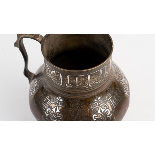 4 - A KHORASSAN SILVER INLAID BRONZE JUG,
NORTH EAST IRAN,
12TH/13TH CENTURY   Benetictory inscription i... 