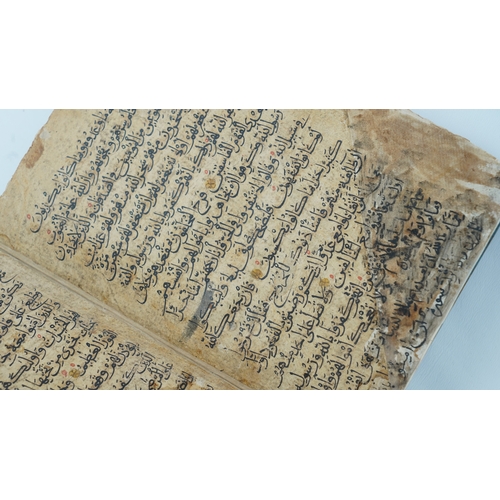 8 - A RARE QUR’AN SECTION,
YEMEN/ IRAQ, 11TH CENTURY.  Arabic manuscript on paper, 18 lines of bold blac... 