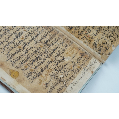 8 - A RARE QUR’AN SECTION,
YEMEN/ IRAQ, 11TH CENTURY.  Arabic manuscript on paper, 18 lines of bold blac... 