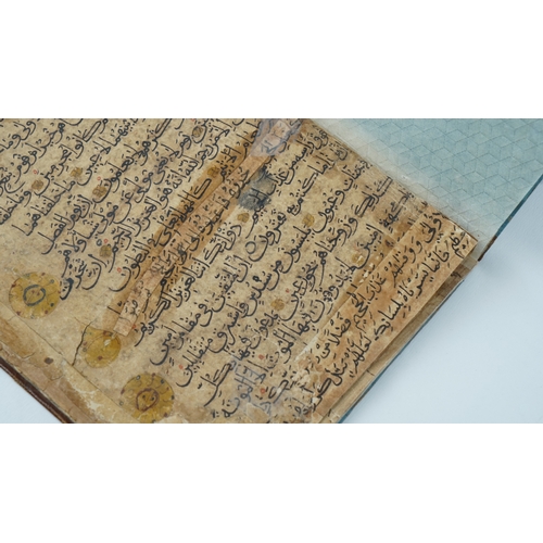 8 - A RARE QUR’AN SECTION,
YEMEN/ IRAQ, 11TH CENTURY.  Arabic manuscript on paper, 18 lines of bold blac... 