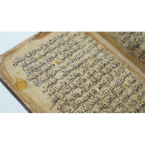 8 - A RARE QUR’AN SECTION,
YEMEN/ IRAQ, 11TH CENTURY.  Arabic manuscript on paper, 18 lines of bold blac... 