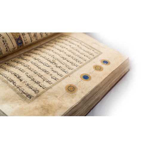 15 - A MASSIVE HERAT QUR’AN   Arabic manuscript on paper, 14 lines of black naskh script,lobbed gold rpou... 