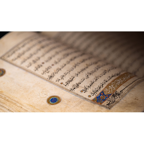 15 - A MASSIVE HERAT QUR’AN   Arabic manuscript on paper, 14 lines of black naskh script,lobbed gold rpou... 