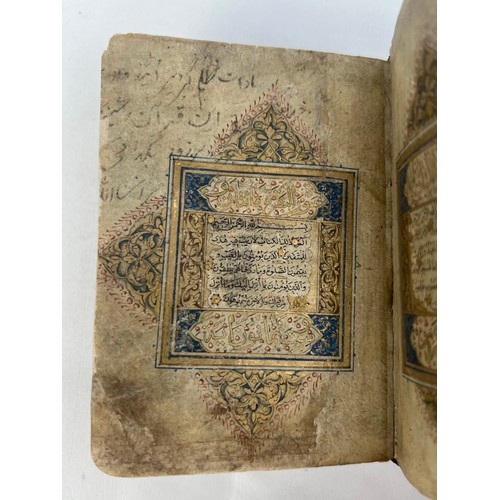 9 - A TIMURID QUR’AN 15TH CENTURY  Arabic manuscript on paper, 16 lines of black naskh script, gold roun... 