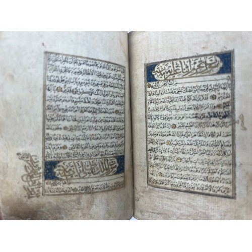 9 - A TIMURID QUR’AN 15TH CENTURY  Arabic manuscript on paper, 16 lines of black naskh script, gold roun... 