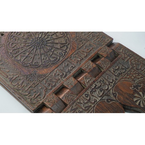 31 - A CARVED WOODEN QUR'AN STAND (RAHLA), OTTOMAN, 15TH CENTURY   Signed by the craftsman  Ahmad bin You... 