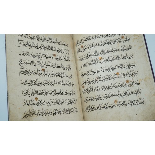 33 - A QUR'AN SECTION   Arabic manuscript on paper, 9 folios plus two flyleaves, 9 lines of elegant black... 