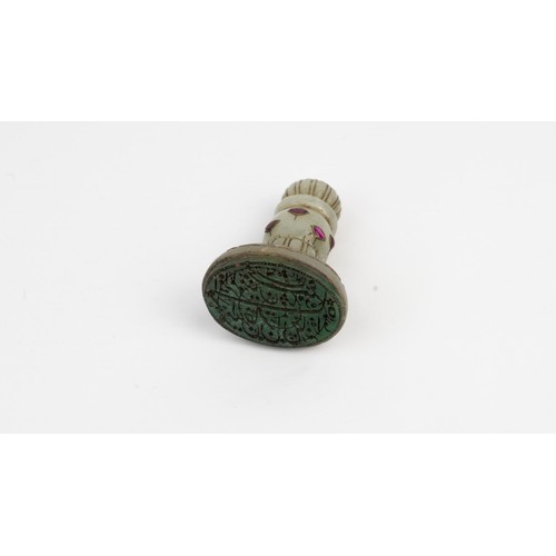 52 - A GEM-SET JADE STAMP SEAL
EARLY 18TH CENTURY, DATED 1132AH/1720AD, MUGHAL, BABUR   Of oval form, mou... 