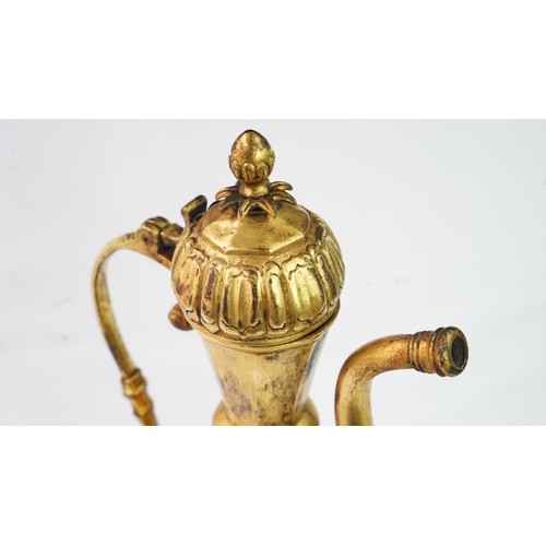 77 - A GILT-COPPER (TOMBAK) EWER
OTTOMAN   Of pyriform form, the tombak ewer on a splayed rounded foot, t... 