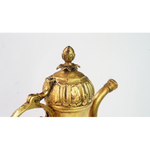 77 - A GILT-COPPER (TOMBAK) EWER
OTTOMAN   Of pyriform form, the tombak ewer on a splayed rounded foot, t... 