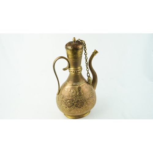 78 - A GILT-COPPER (TOMBAK) ZAM ZAM EWER
OTTOMAN  Of pyriform form, the tombak ewer on a splayed rounded ... 