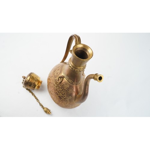 78 - A GILT-COPPER (TOMBAK) ZAM ZAM EWER
OTTOMAN  Of pyriform form, the tombak ewer on a splayed rounded ... 