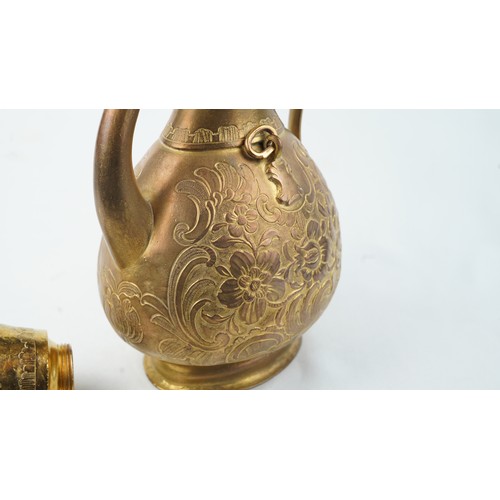 78 - A GILT-COPPER (TOMBAK) ZAM ZAM EWER
OTTOMAN  Of pyriform form, the tombak ewer on a splayed rounded ... 