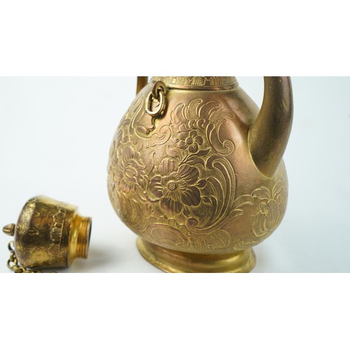 78 - A GILT-COPPER (TOMBAK) ZAM ZAM EWER
OTTOMAN  Of pyriform form, the tombak ewer on a splayed rounded ... 