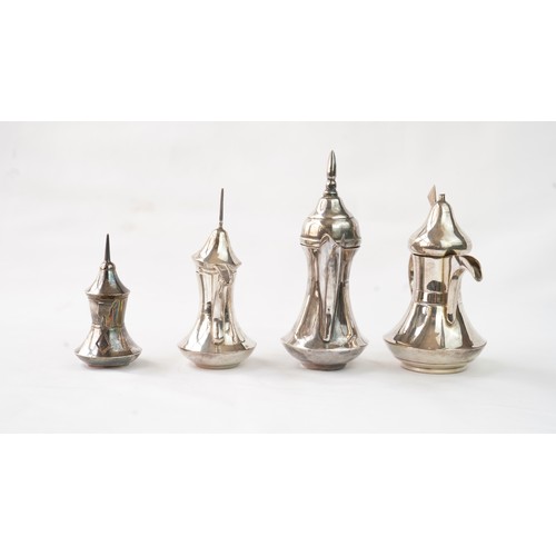 80 - A SET OF FOUR IRAQ SILVER DALLAH COFFEE POTS   Of traditional shapes, silver coffee pots with long s... 