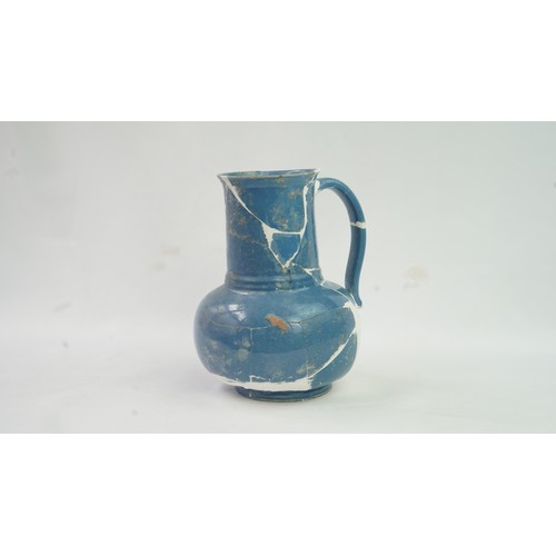 91 - IZNIK  POTTERY JUG, OTTOMAN TURKEY, 16TH CENTURY   Of baluster form rising from short foot to slight... 