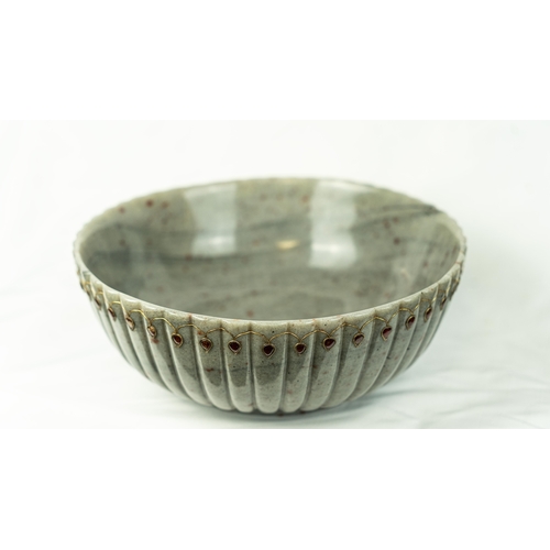 100 - A LARGE GREY JASPER BOWL
Of poly-lobed form, carved in grey jasper with speckled rust, resting on a ... 