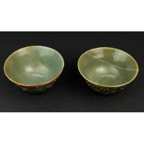 102 - A PAIR OF MUGHAL STYLE JADE CUPS, 20TH CENTURY
Of conical form, resting on small cylindrical base, c... 