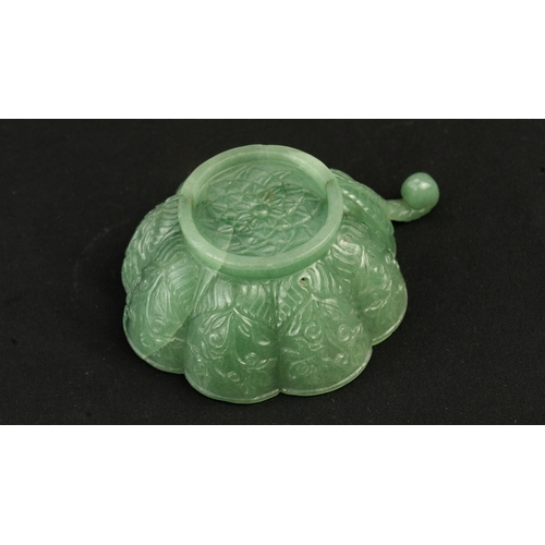 104 - A SMALL MUGHAL-STYLE GREEN JADEITE BOWL, AGRA, INDIA
Of polylobed flared form, resting on a short ci... 