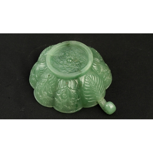 104 - A SMALL MUGHAL-STYLE GREEN JADEITE BOWL, AGRA, INDIA
Of polylobed flared form, resting on a short ci... 