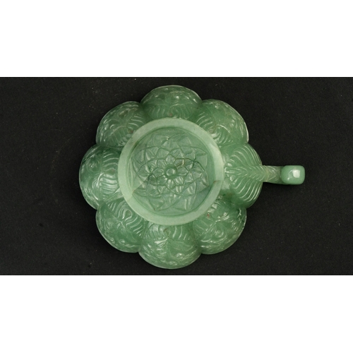 104 - A SMALL MUGHAL-STYLE GREEN JADEITE BOWL, AGRA, INDIA
Of polylobed flared form, resting on a short ci... 