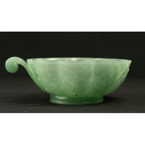 104 - A SMALL MUGHAL-STYLE GREEN JADEITE BOWL, AGRA, INDIA
Of polylobed flared form, resting on a short ci... 