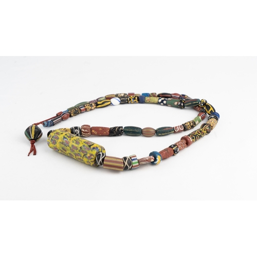 109 - A ROMAN STYLE MILLEFIORI NECKLACE
A beaded necklace formed of a variety of glass beads, featuring a ... 