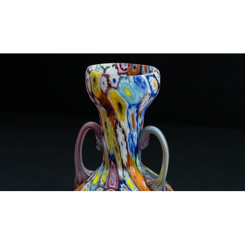 114 - A FRATELLI TOSO MURANO MILLEFIORI VASE
Of compressed bulbous shape, resting on a flat base, with a t... 